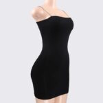 black Essential Square Neck Mini Dress (4) Women's black square neck bodycon mini dress displayed on a mannequin with delicate spaghetti straps.