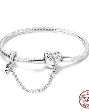 Silver snake chain charm bracelet with a heart shaped clasp engraved Forever, clear crystal detail and attached safety chain.