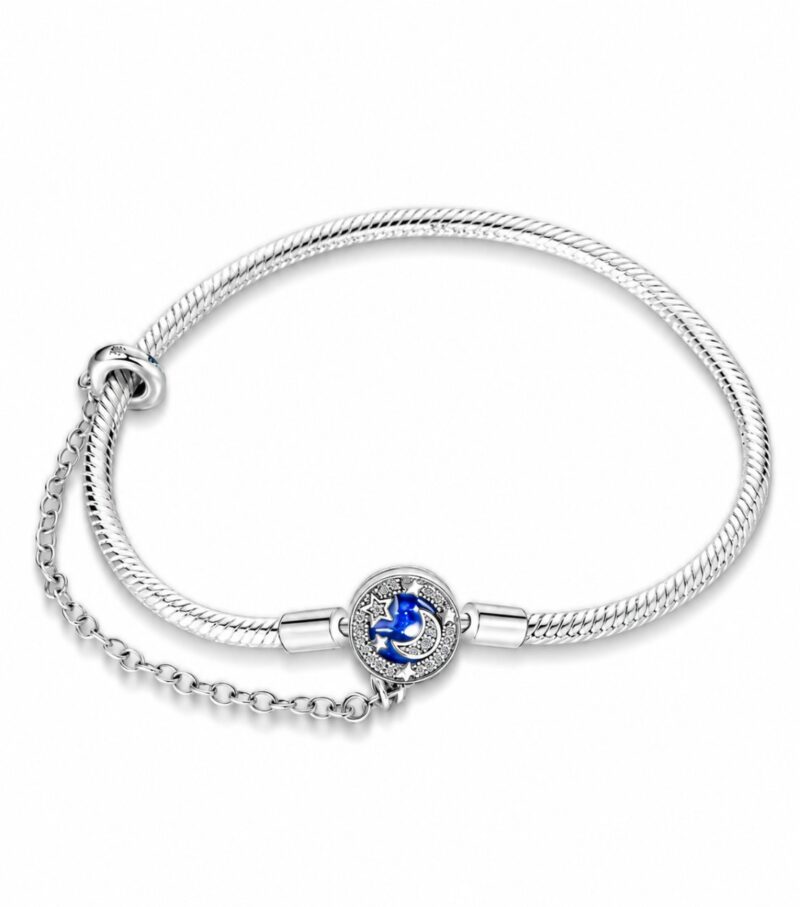 Silver Moon Star Charm Bracelet (1) Silver moon star charm bracelet with blue enamel crescent moon, sparkling star details, crystal accents, safety chain, and snake chain design.