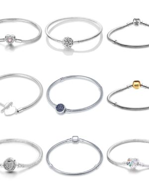 Collection of silver snake chain charm bracelets featuring heart, floral, pavé, gold-tone, blue stone and decorative clasp designs.
