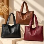 Avery Large Tote Bag (1) Avery Large Tote Bag collection in black, brown and burgundy with wide shoulder straps and spacious structured design