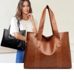 Avery Large Tote Bag (2) Avery Large Tote Bag in brown with wide shoulder straps and spacious everyday design, shown alongside black tote bag