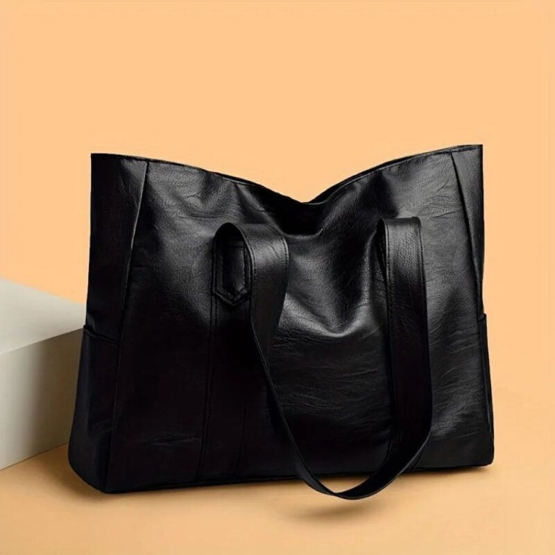 Black Avery Large Tote Bag shown from the back with long shoulder straps, spacious body and soft textured finish