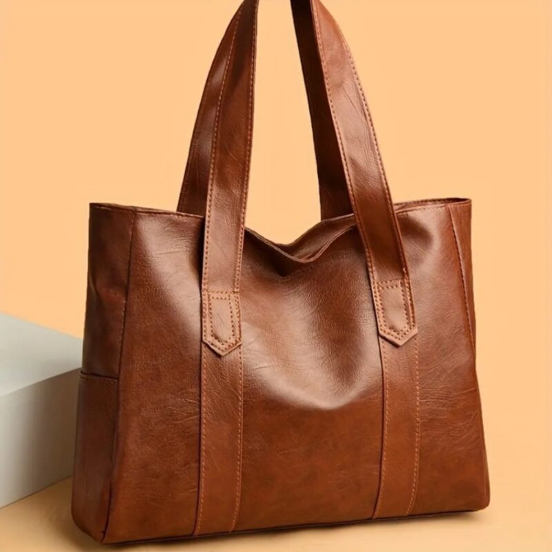 Brown Avery Large Tote Bag with wide double shoulder straps, roomy everyday design and soft leather-look texture