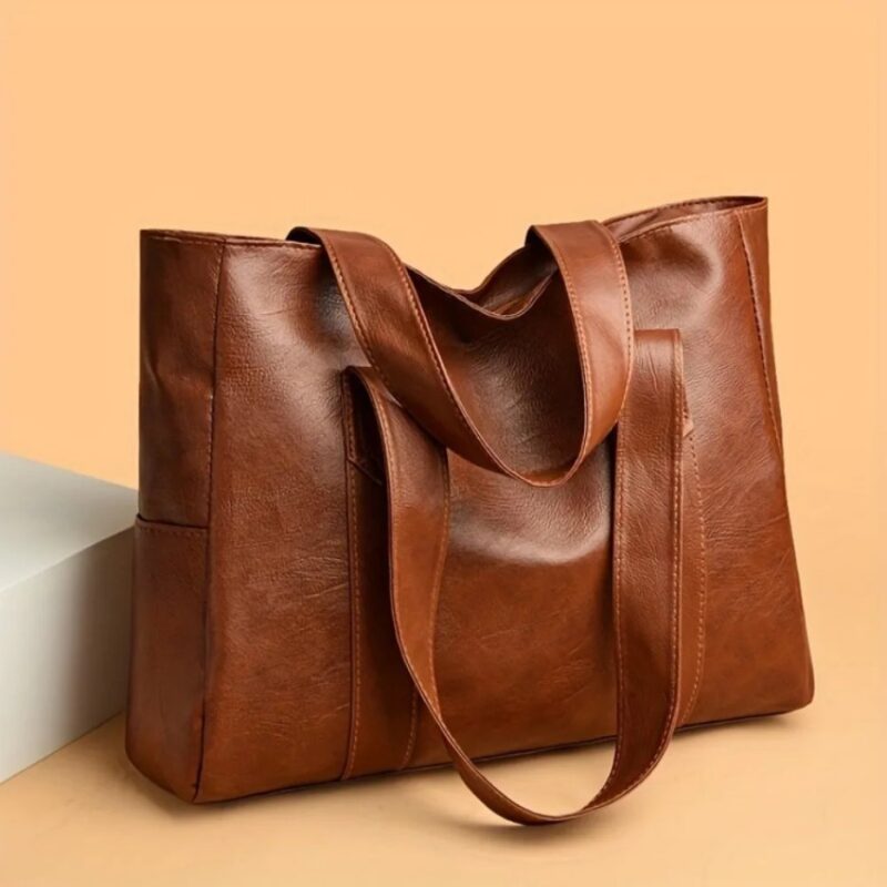 Brown Avery Large Tote Bag shown with relaxed shoulder straps, spacious rectangular shape and textured finish