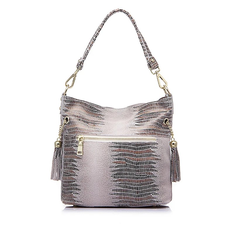 Beige alligator embossed women’s bucket bag shown from the back with exterior zipper pocket, shoulder handle, and tassel details