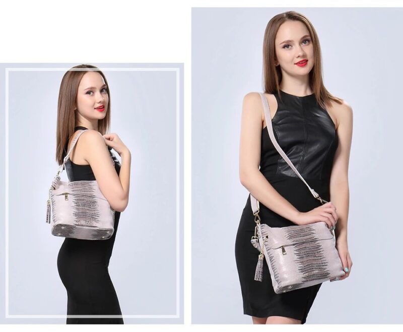 Beige alligator embossed bucket bag for women modeled as a shoulder bag and crossbody bag with adjustable long strap