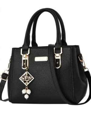 Black Camellia Pearl Charm handbag with double top handles, detachable shoulder strap, gold tone hardware and decorative pearl charm