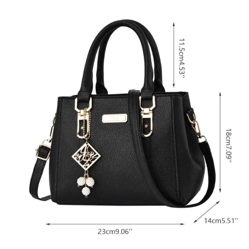 Black Camellia Pearl Charm handbag size guide showing 23 cm width, 18 cm height, 14 cm depth and 11.5 cm handle drop
