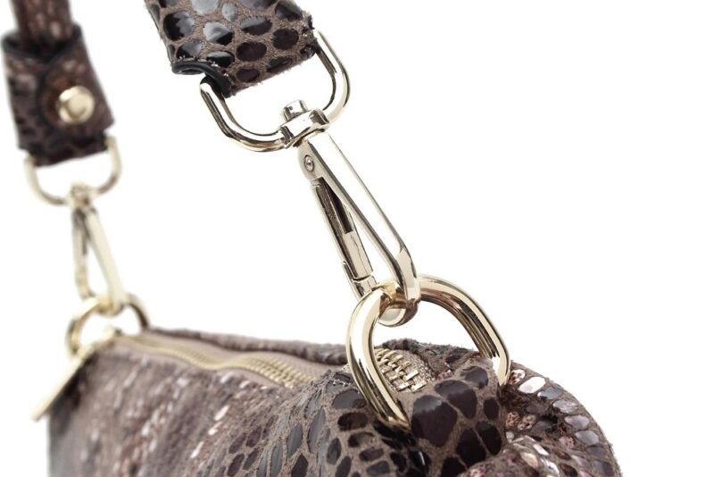 Close-up of brown Cobra Snake Print bucket bag showing detachable top handle clasp, gold tone ring and snakeskin texture