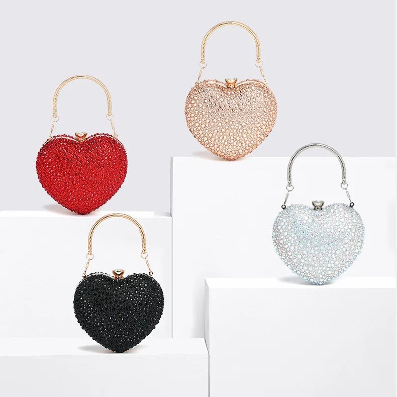 Cupid Rhinestone Heart Clutch (1) Rhinestone heart clutch bags in red, champagne, black and silver AB with sparkling crystals and metal top handles