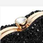 Cupid Rhinestone Heart Clutch (5) Close-up of black rhinestone heart clutch bag crystal clasp with polished gold metal frame
