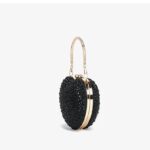 Cupid Rhinestone Heart Clutch (7) Side view of black rhinestone heart clutch bag showing gold metal frame, structured shape and top handle