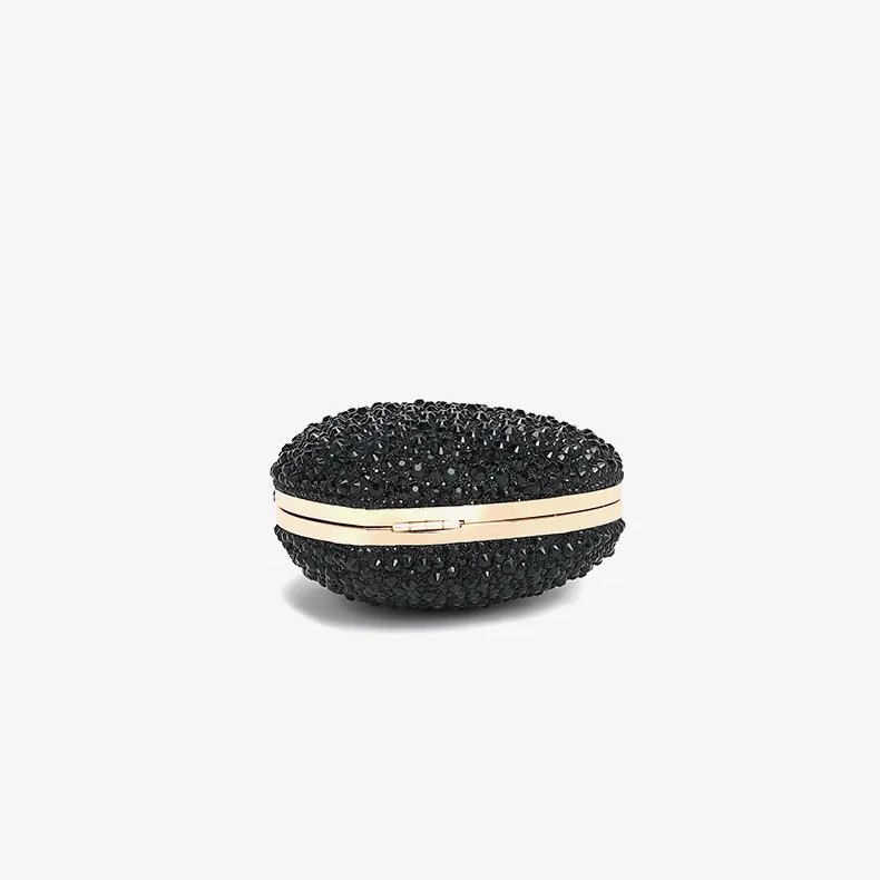 Bottom view of black rhinestone heart clutch bag showing sparkling crystal finish and gold metal frame