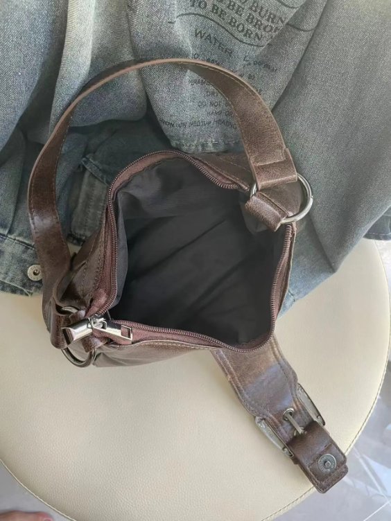 Open brown Dalton Retro Buckle Shoulder Bag showing zip-top closure, dark fabric lining and spacious main compartment