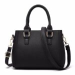 Back view of black Darling Pom Pom handbag with textured finish, double top handles and adjustable shoulder strap