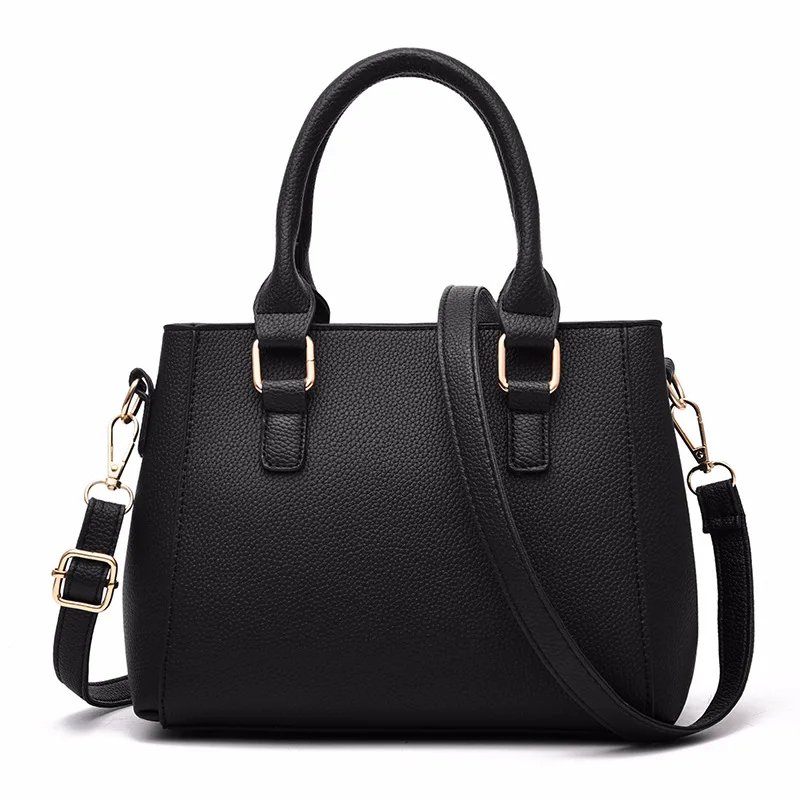 Back view of black Darling Pom Pom handbag with textured finish, double top handles and adjustable shoulder strap