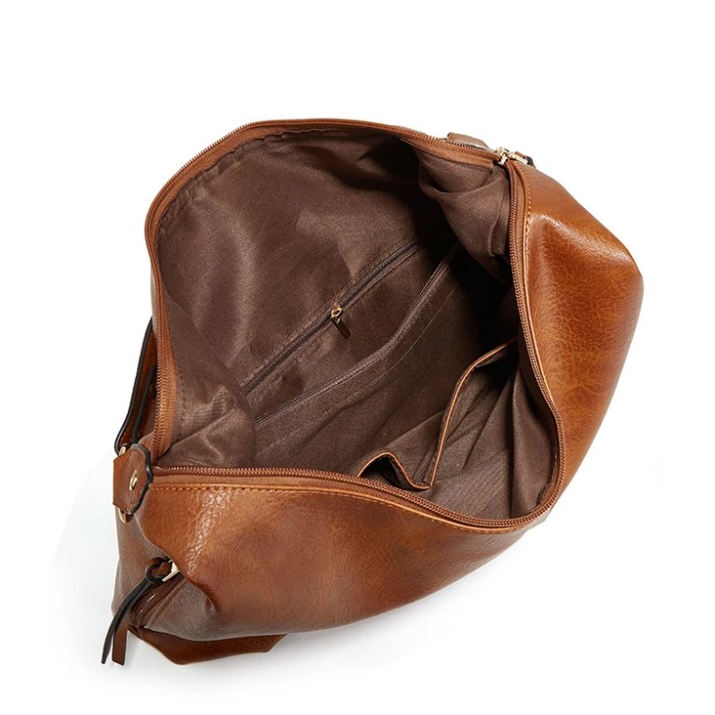 Interior view of brown Delaney Large Hobo Bag showing spacious fabric-lined main compartment, top zipper closure and internal zippered pocket