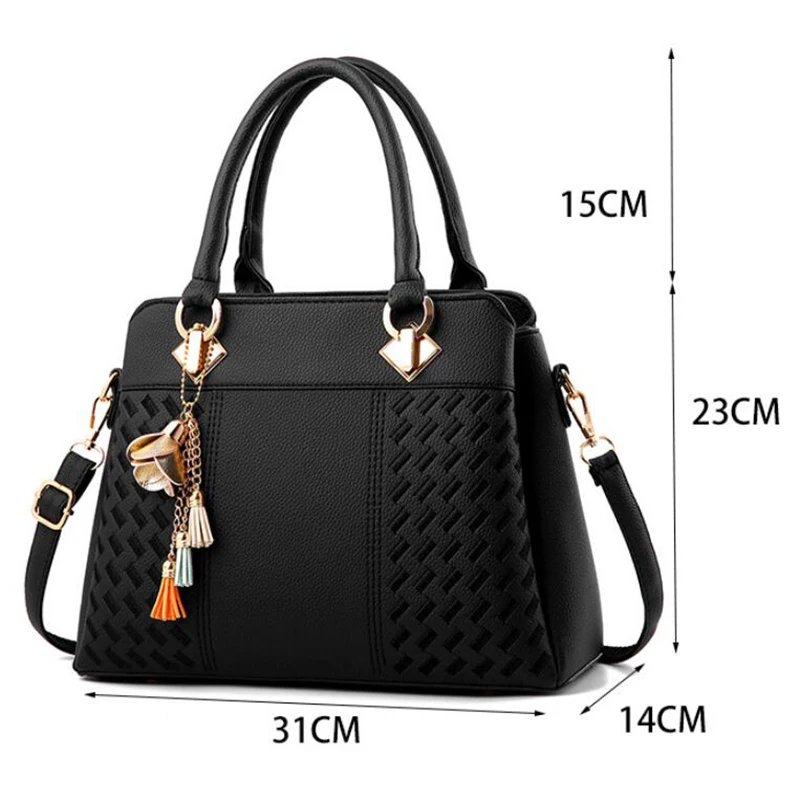 Black Delphine Tassel Charm handbag size guide showing 31 cm width, 23 cm height, 14 cm depth and 15 cm handle drop