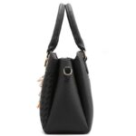 Delphine Tassel Charm Handbag-black (6) Side view of black Delphine Tassel Charm handbag showing structured profile, top handles and gold tone shoulder strap attachment