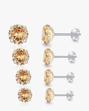 Elodie champagne CZ stud earrings in four sizes, featuring round champagne-coloured cubic zirconia stones set in polished silver-tone four-prong settings.