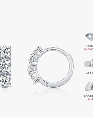 Giselle Three Stone Moissanite Huggie Earrings (1) Alt text: Giselle three stone moissanite huggie earrings in polished 925 sterling silver, shown from the front and side with round D colour stones.