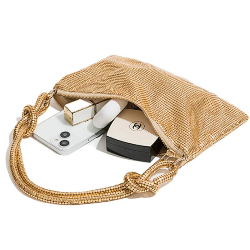 Gold metallic mesh evening bag shown open with phone, cosmetics and small essentials inside the spacious main compartment