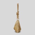 Gleam Metallic Mesh Evening Bag-gold (6) Side view of gold metallic mesh evening bag showing slim triangular profile, sparkling finish and knotted shoulder strap