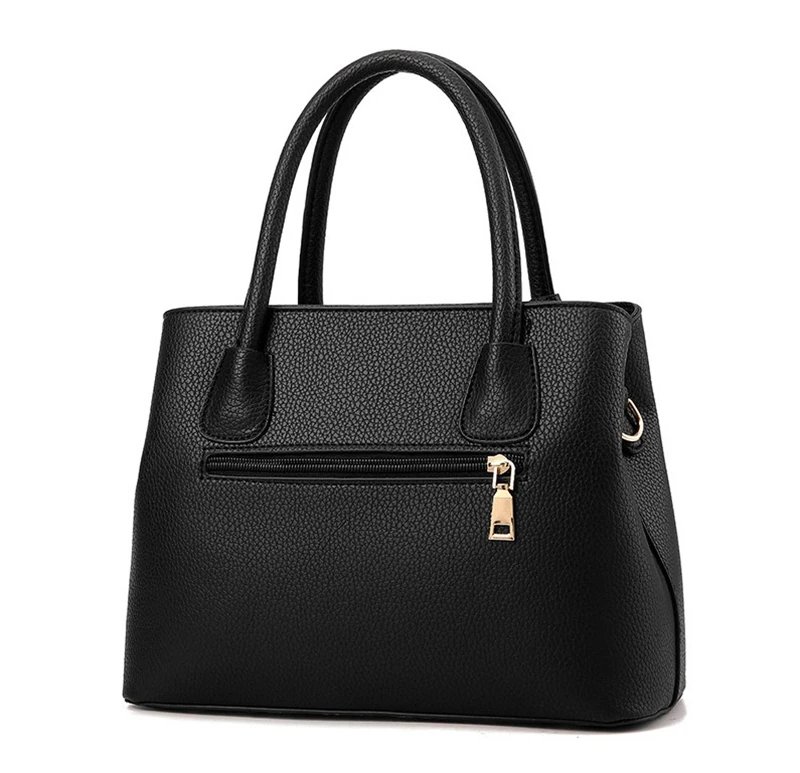 Back view of black textured satchel handbag with double handles, exterior zip pocket and gold-tone zip pull