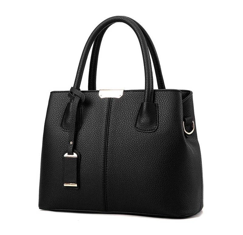 Angled front view of black structured satchel bag with textured finish, double handles and metal hardware