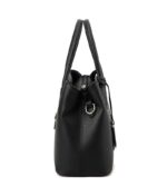 Side view of black textured top handle satchel bag showing structured depth and metal shoulder strap ring