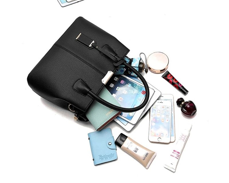 Black structured satchel bag displayed with tablet, phone, wallet, cosmetics and other everyday essentials