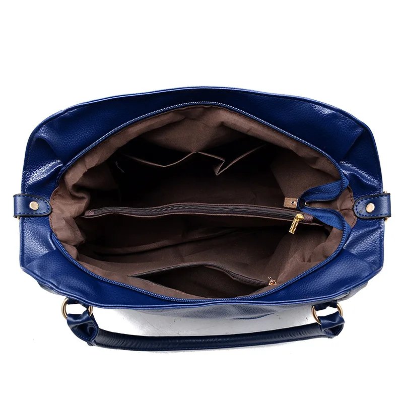 Interior view of blue Linden soft hobo satchel bag showing spacious lined compartments, zip divider and storage pockets