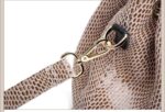 Mamba Snake Embossed Hobo Bag-beige (7) Close-up of beige snake embossed hobo bag adjustable shoulder strap attached with a gold tone swivel clasp and metal ring