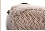 Mamba Snake Embossed Hobo Bag-beige (8) Close-up of beige snake embossed hobo handbag base showing reinforced stitching and textured snake pattern construction