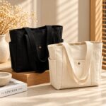 Maren Canvas Tote Bag Maren Canvas Tote Bag collection in black and beige with long shoulder straps, multiple exterior pockets and durable canvas fabric