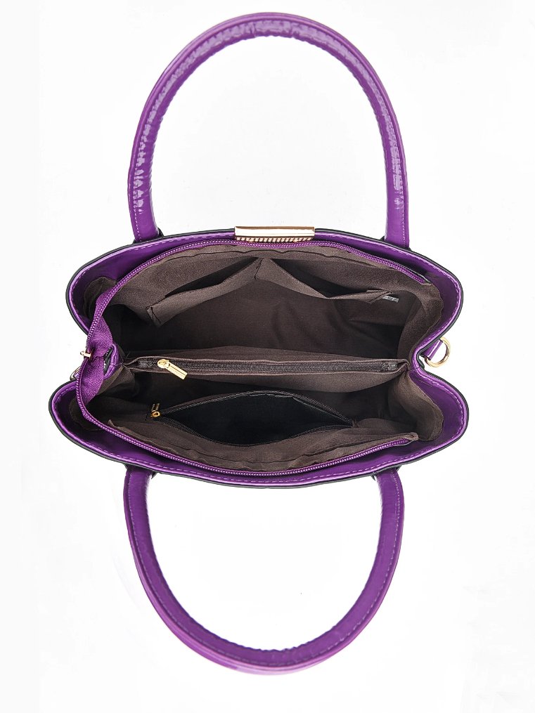 Interior view of purple Marlow croc embossed satchel bag showing lined compartments, pockets and zip sections