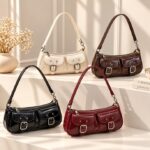 Quinn Double Pocket Shoulder Bag Quinn Double Pocket Shoulder Bag collection in cream, coffee brown, black and burgundy with twin front pockets and buckle details