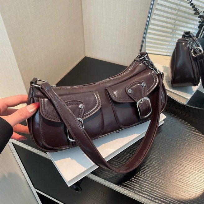 Coffee brown Quinn Double Pocket Shoulder Bag displayed with two front flap pockets, buckle details, zip closure and shoulder strap