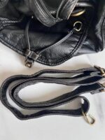 Reese Vintage Washed Shoulder Bag (11) Detachable adjustable shoulder strap of black Reese Vintage Washed Shoulder Bag with matching textured finish and antique gold-tone swivel clasps