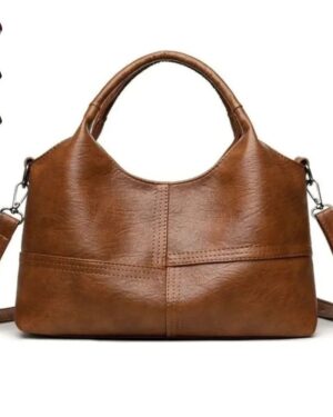 Brown Rowan retro crossbody bag with rounded top handles, detachable shoulder strap and stitched panel detailing