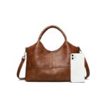 Rowan Retro Crossbody Bag-brown (10) Brown Rowan retro crossbody bag displayed beside a smartphone to show the handbag size