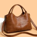 Rowan Retro Crossbody Bag-brown (2) Brown Rowan retro handbag with top handles, long shoulder strap and stitched panel detailing