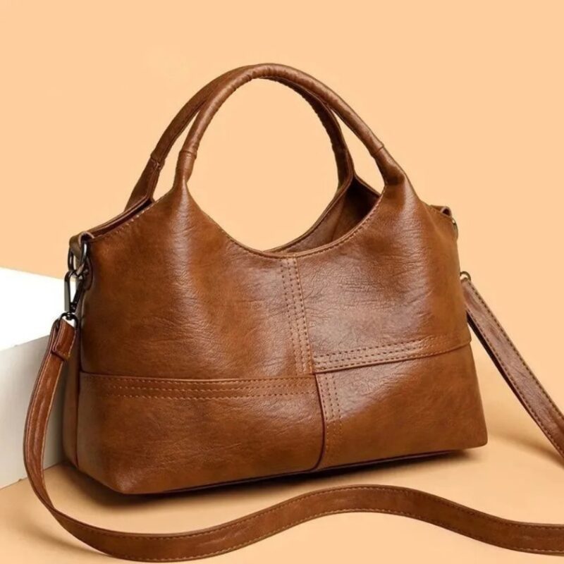 Brown Rowan retro handbag with top handles, long shoulder strap and stitched panel detailing