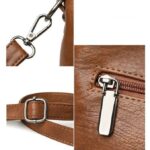 Rowan Retro Crossbody Bag-brown (4) Close-up of brown Rowan retro crossbody bag hardware, adjustable strap buckle and zip fastening