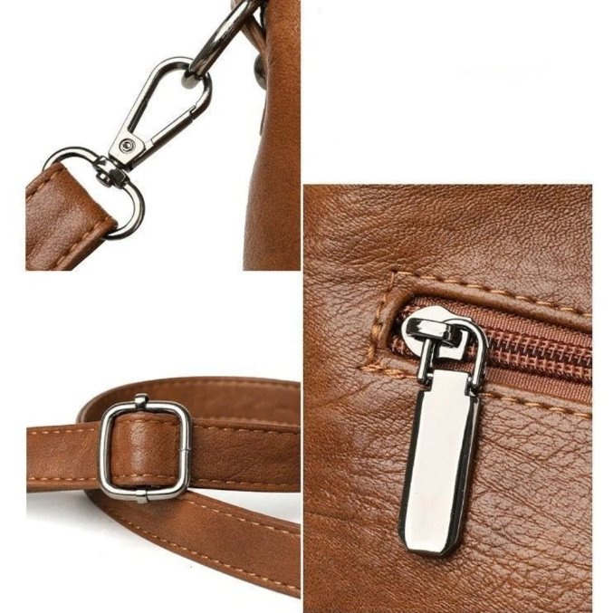 Close-up of brown Rowan retro crossbody bag hardware, adjustable strap buckle and zip fastening