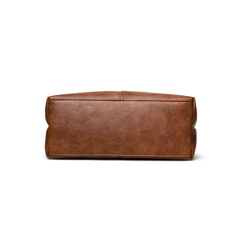 Bottom view of brown Rowan retro handbag showing flat rectangular base and textured finish