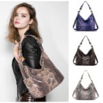 Serpentine Hobo Snake Print Shoulder Bag (2) Women’s snake print hobo shoulder bag modeled on the shoulder with blue, black, and beige color options shown