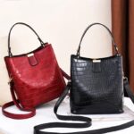 Sienna Croc Pattern Bucket Bag (1) Sienna croc pattern bucket bags in red and black with top handles, detachable shoulder straps and gold tone hardware