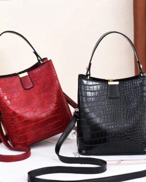 Sienna croc pattern bucket bags in red and black with top handles, detachable shoulder straps and gold tone hardware